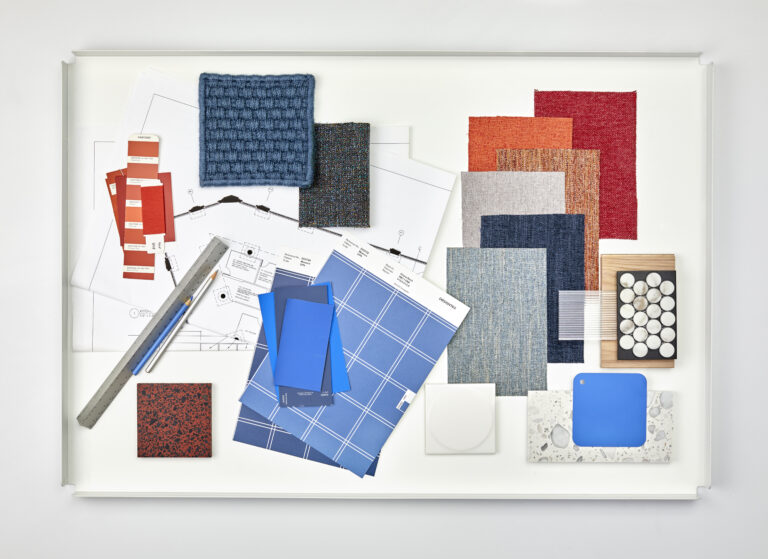 A design palette consisting of textile memo samples, paint swatches, and tile.