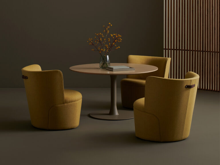 Table encirled by three Davis Toute lounge chairs.