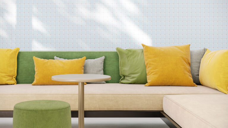 Upholstered sofa, pouf and pillows with Designtex Crypton textiles