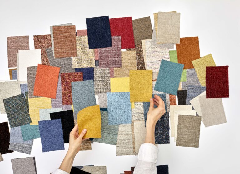 Many swatches of Designtex Crypton textiles with hands
