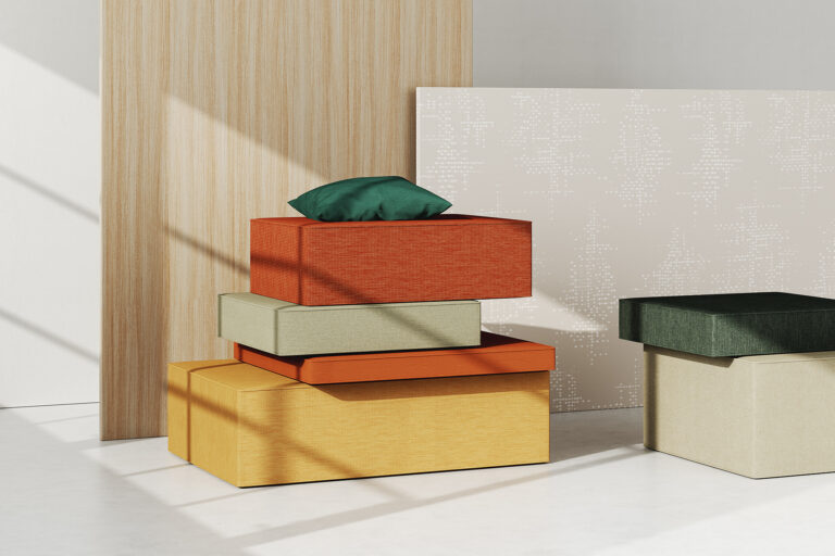 Stacked upholstered pillows in Designtex Crypton textiles