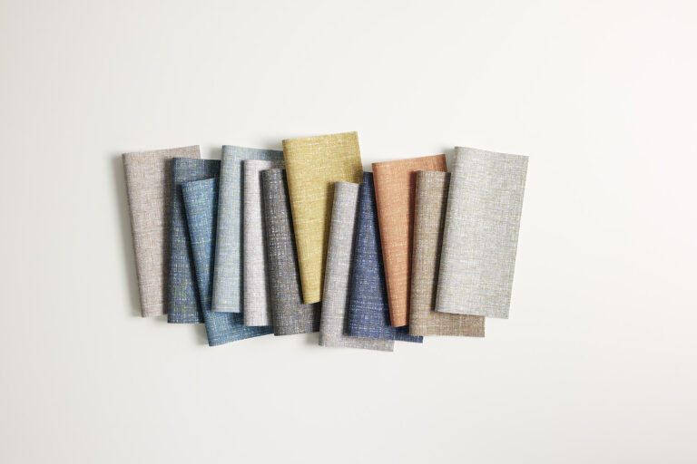 A row of various colored coated material samples consisting of a multi-color texture like pattern.